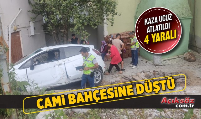 Otomobil istinat duvarından cami bahçesine düştü;